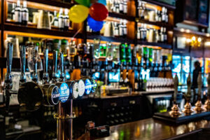 Closeup of a bar with balloons hung up